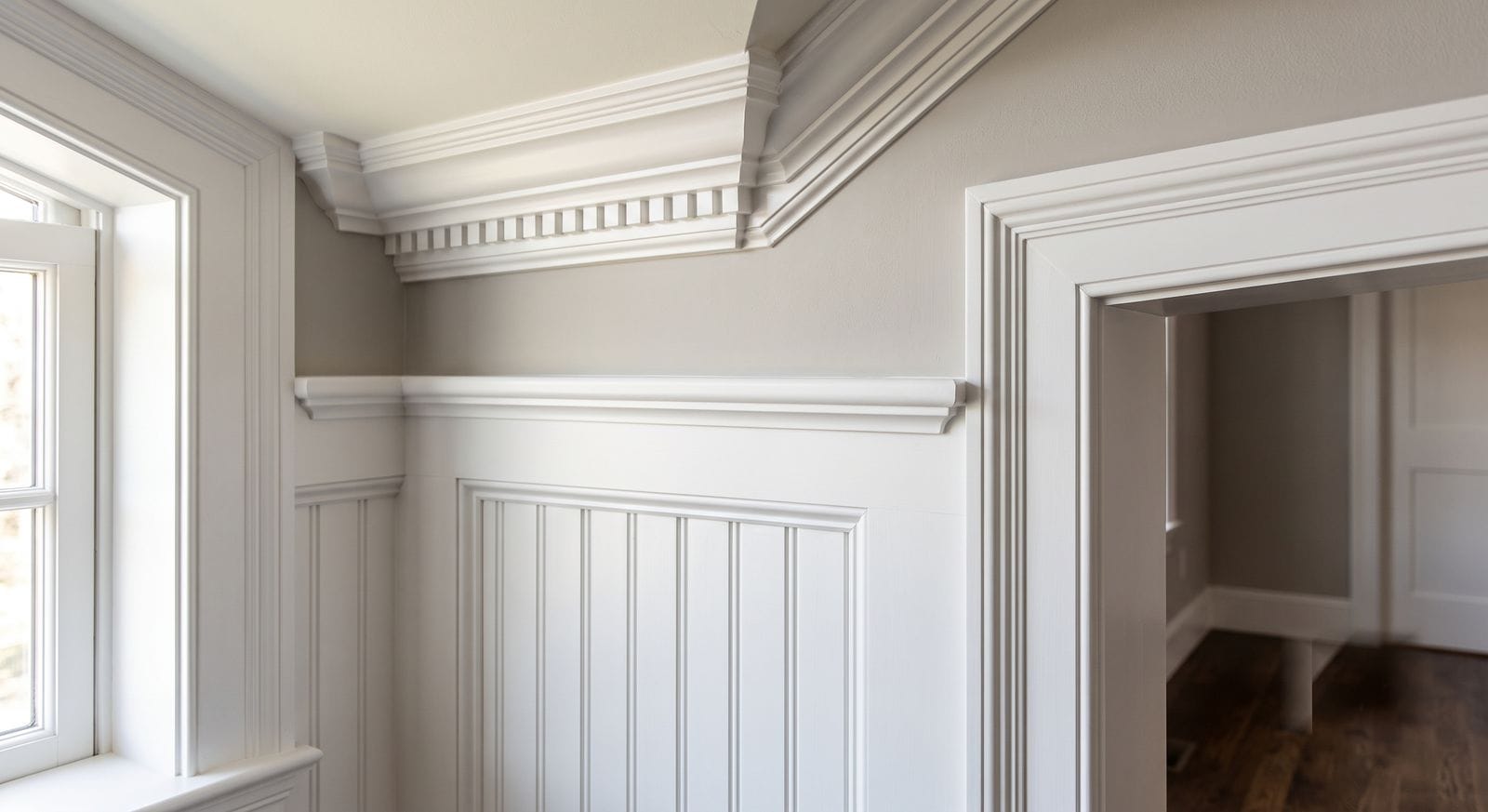 Meticulously painted crown moulding and wainscoting in a high-end Medfield, Massachusetts home