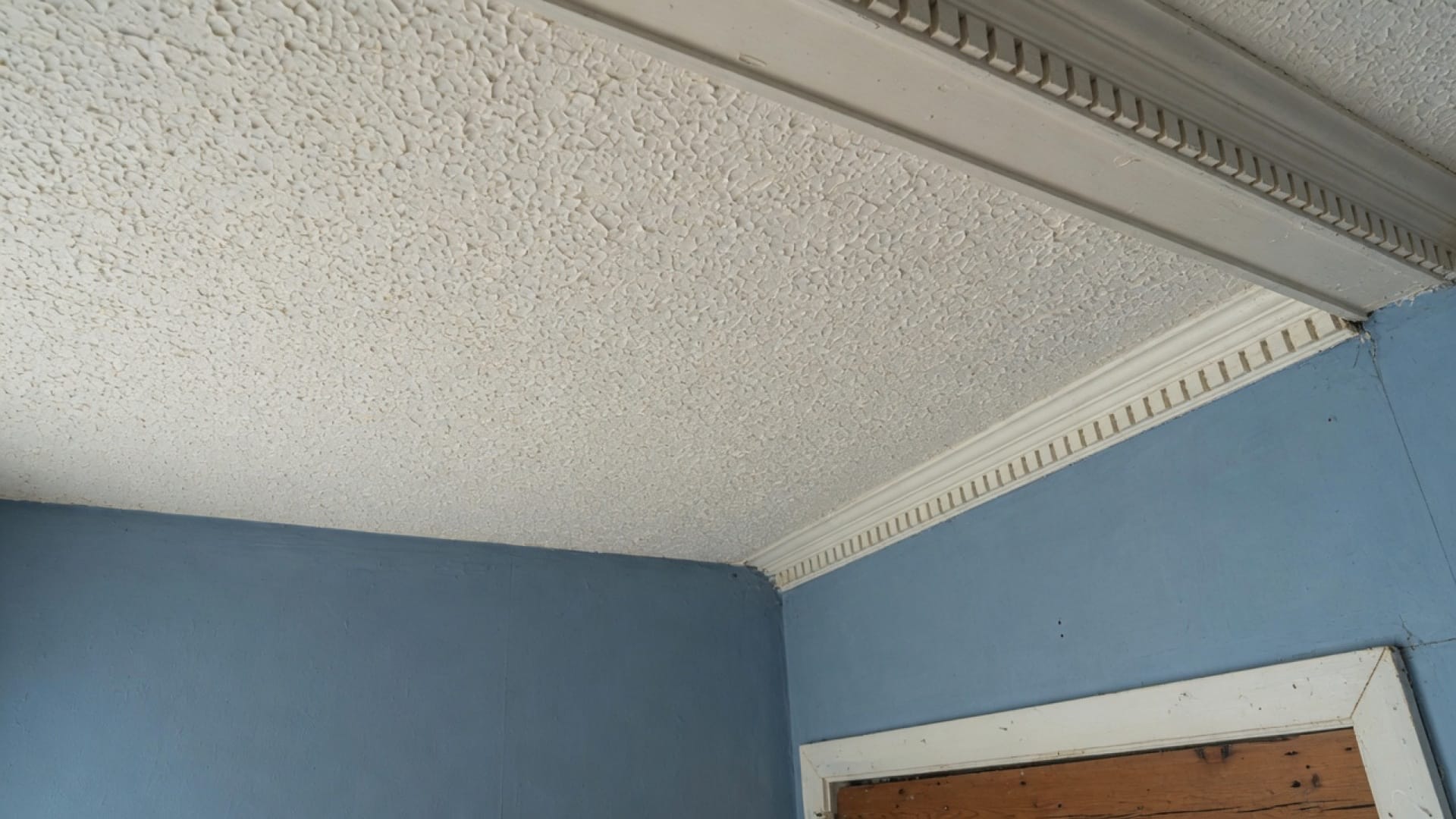 Intact popcorn ceiling texture in a Needham MA colonial bedroom, even north light, no people