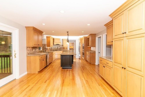Spacious kitchen with maple cabinetry